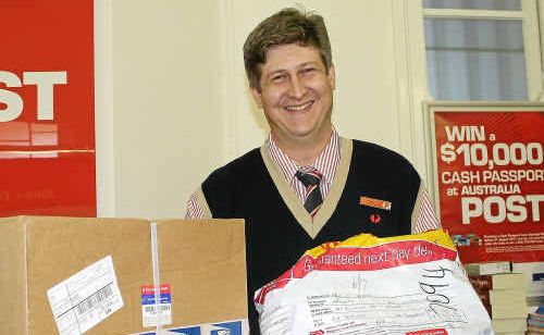 Post manager Kyle Hughes has been kept busy as more people turn to online shopping. Post manager Kyle Hughes has been kept busy as more people turn to online shopping.